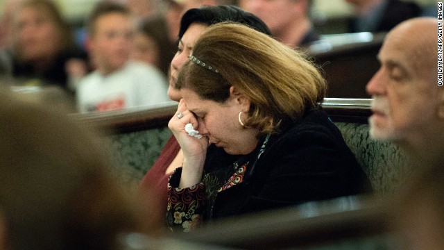 Visitors fill Arlington Street Church for a candlelight vigil on April 16.