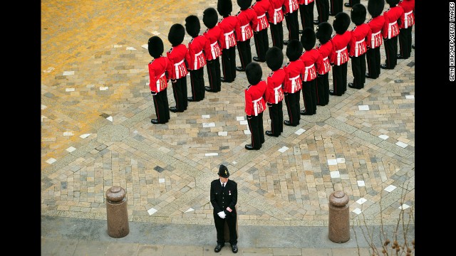 Guardsmen stand to attention outside St Paul's Cathedral.