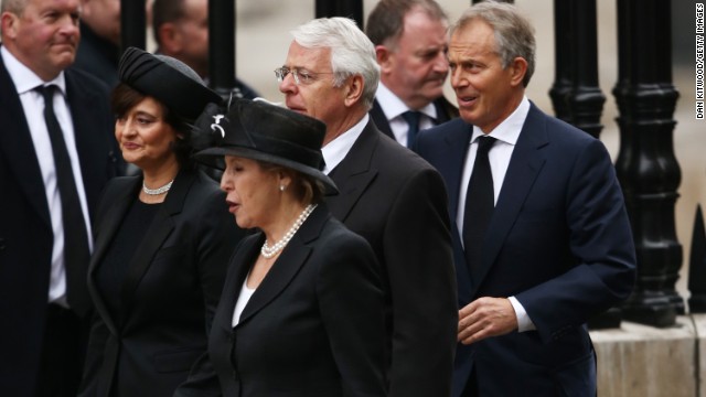 Former Prime Ministers John Major, center, and Tony Blair attend the funeral with wives Norma Major and Cherie Blair, left.