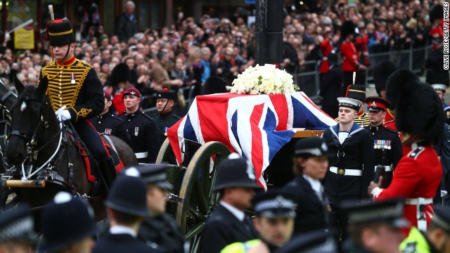 The gun carriage carrying the coffin is drawn by the King's Troop, Royal Horse Artillery.
