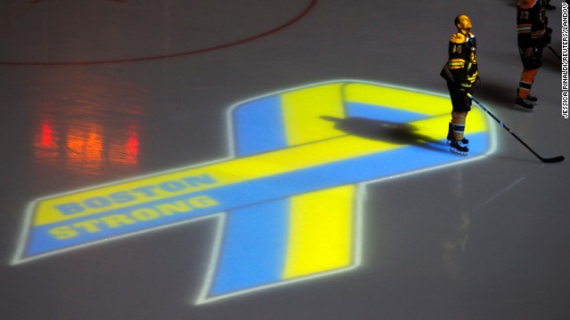 Dennis Seidenberg of the Boston Bruins observes a moment of silence for the victims of the Boston Marathon bombings before the start of an NHL hockey game in Boston against the Buffalo Sabres on Wednesday, April 17. It was the first sporting event held in the city since the bombings.