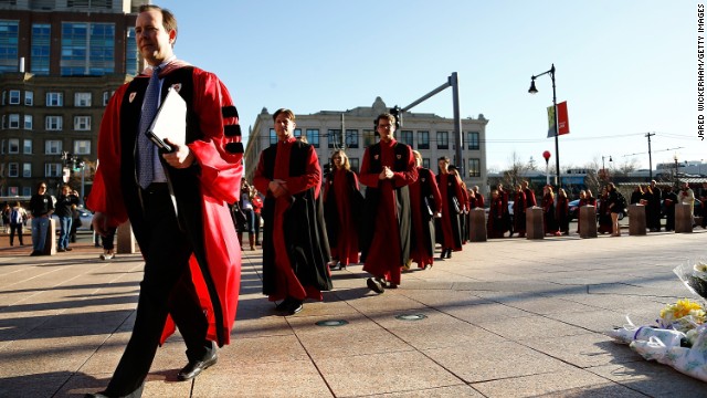 Prior to an April 17 service at Marsh Chapel on the Boston University campus, members of the clergy walk past a memorial for graduate student Lu Lingzi, who was identified as the third person killed in the terror attack. Previously identified were Krystle Campbell, 29, of Arlington, Massachusetts, and Martin Richard, 8, of Dorchester, Massachusetts.