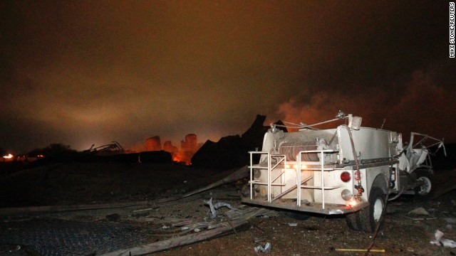 A vehicle is seen near the remains of the fertilizer plant. 