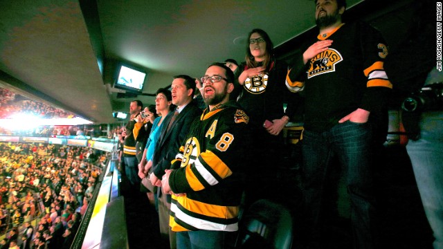 Boston Bruins fans sing the national anthem during pregame ceremonies on April 17 in remembrance of the Boston Marathon bombing victims.