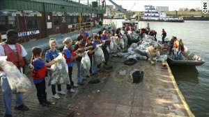 Volunteers in Memphis, Tennessee, sort out the garbage from a recent Mississippi River cleanup.