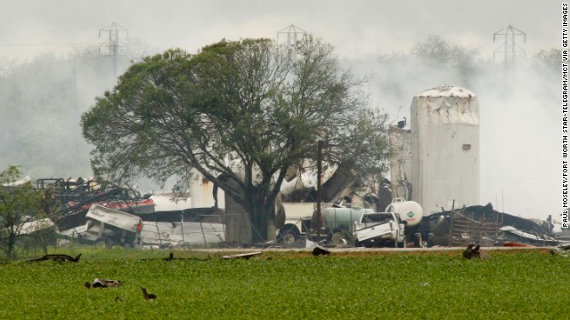 Debris litters the fields around a fertilizer plant on April 18, the day after the explosion. The blast damaged 50 to 60 homes in a five-block area, officials said.