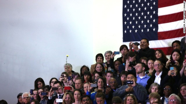 People watch President Obama at Cathedral High School in Boston on April 18.