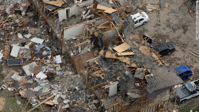 Search and rescue workers comb through what remains of a 50-unit apartment building on April 18.