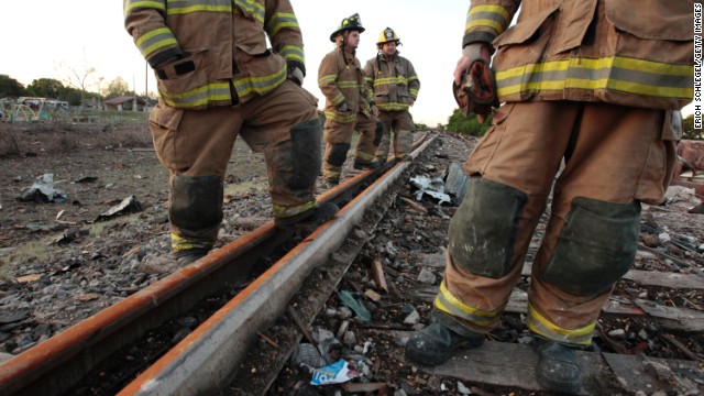 Valley Mills Fire Department personnel view the railroad tracks near the fertilizer plant on April 18.