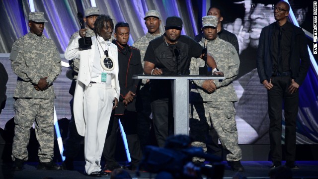 Public Enemy speaks onstage at the ceremony.