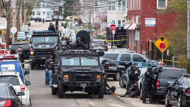 SWAT teams move into position at the intersection of Nichols and Melendy avenues in Watertown, Massachusetts, on Friday. 