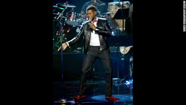 Usher performs onstage.