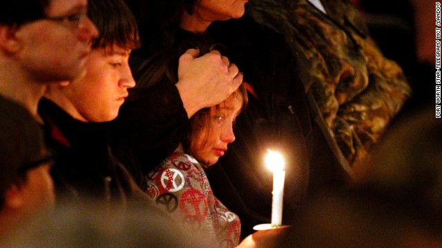 A young mourner is comforted during the vigil on April 18.