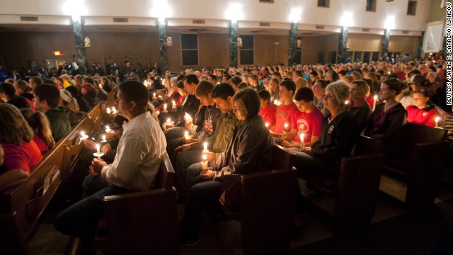 A candlelight vigil is held at St. Mary's Catholic Church in West, Texas, on Thursday, April 18.