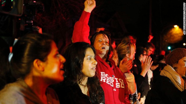 Local residents cheer to news that police have captured the surviving suspect Watertown on April 19.