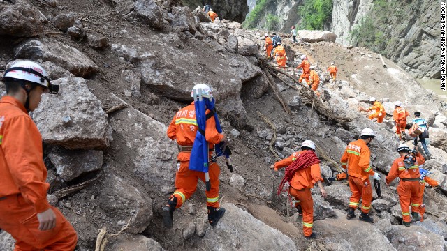 Rescuers head for Baosheng township on Saturday.