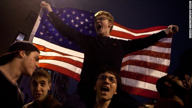 Hundreds of people pour onto Hemingway Street in the Fenway neighborhood to celebrate after the announcement that the second Boston Marathon bombing suspect had been captured on Friday, April 19. 