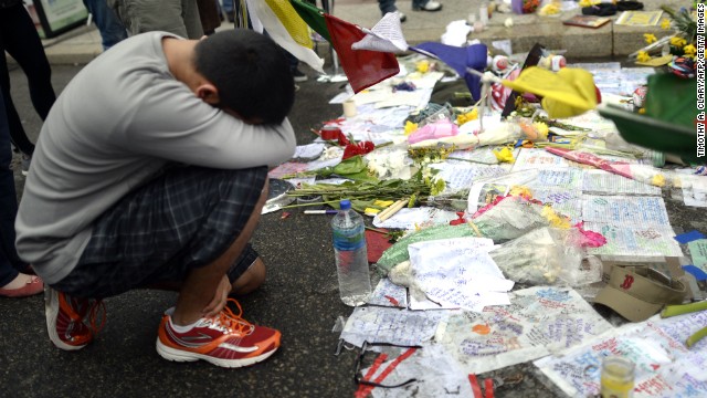 A boy visits a makeshift memorial on Boylston Street in Boston on April 20.