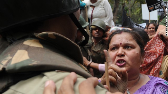  argue with Indian police outside the residence of Sonia Gandhi, chairwoman of the United Progressive Alliance, in New Delhi on Sunday, April 21, at a demonstration against the alleged rape of a 5-year-old girl. 