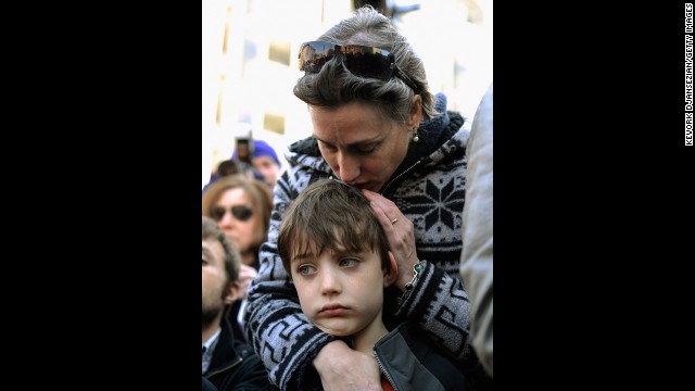 Crowds gathered to participate in an interfaith memorial service with leaders from six churches at a makeshift memorial for victims near the site of the Boston Marathon bombings at the intersection of Boylston and Berkeley streets on April 21.