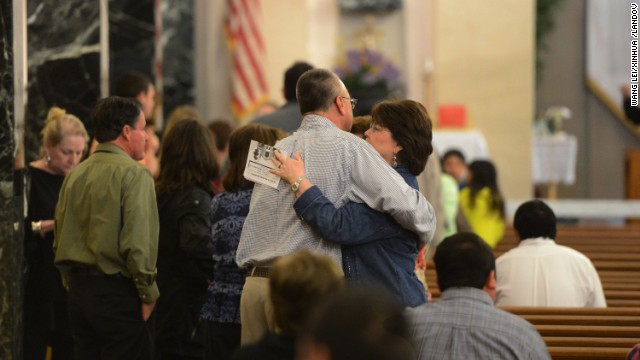 Local residents attend a commemoration ceremony on April 21 for those that perished during the fertilizer explosion.