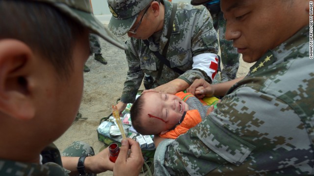 An injured boy receives treatment on Monday. 