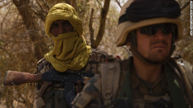 A member of the Malian special forces and a French soldier on April 10, 2013, north of Gao, Mali.