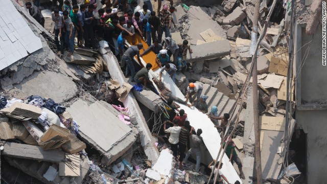 People search for garment workers trapped under the debris on April 24.