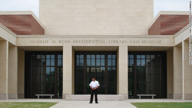 A security guard stands in front of the George W. Bush Presidential Library and Museum, part of the George W. Bush Presidential Center on the Southern Methodist University campus in Dallas, on Tuesday, April 16.