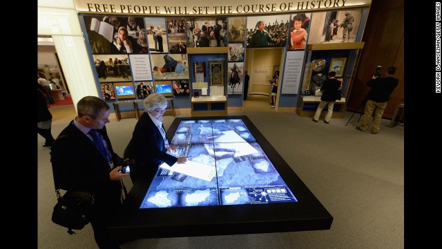 Patricia Flynn shows off the interactive table of conflicts in the Middle East.