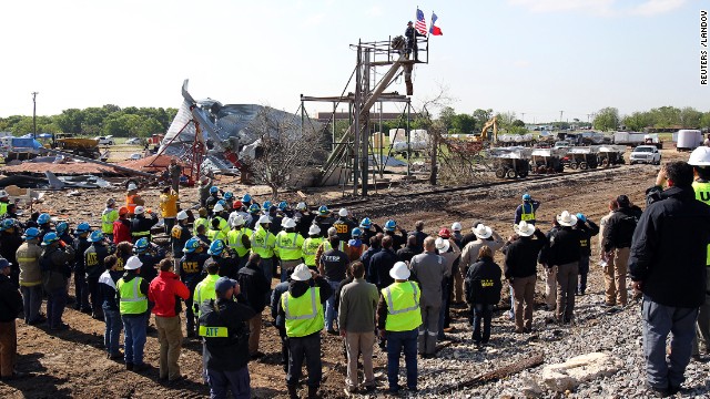 A bugler plays taps at a memorial ceremony at the site of the explosion in West on April 24. 