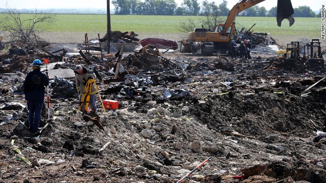 Forensic mappers work the crater at the site of the fire and explosion in West, Texas, on Wednesday, April 24. The plant run by West Fertilizer Co. in the small Texas town exploded on Wednesday, April 17, killing 14 people, most of them emergency responders. Dozens were injured.