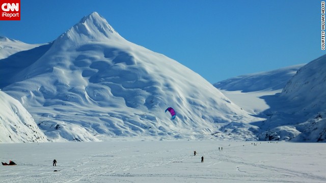 Kite skiers and cross-country skiers enjoy frozen <a href='http://ireport.cnn.com/docs/DOC-943382'>Portage Lake</a> near Anchorage, Alaska.