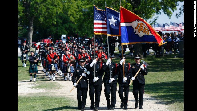 Firefighters lead the funeral procession for Capt. Kenneth "Luckey" Harris Jr. on Thursday, April 24, in West, Texas. 