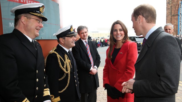 Rear Adm. Simon Robert Lister and Cmdr. Steve Garrett greet Catherine and her husband, Prince William, as they visit the Astute-class Submarine Building on April 5.