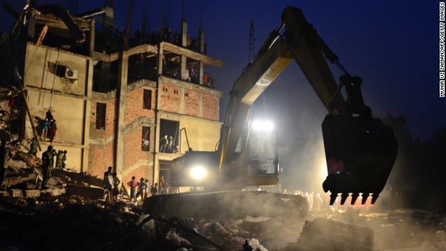 An excavator operated by the Bangladeshi Army removes debris on April 26.