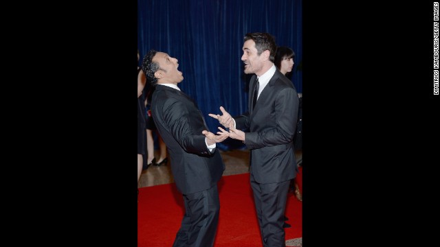 Actor and comedian Aasif Mandvi, from "The Daily Show," and Ty Burrel, from "Modern Family," greet each other on the red carpet.