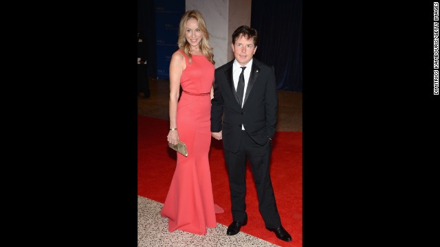 Tracy Pollan and husband Michael J. Fox pause on the red carpet for a photograph.