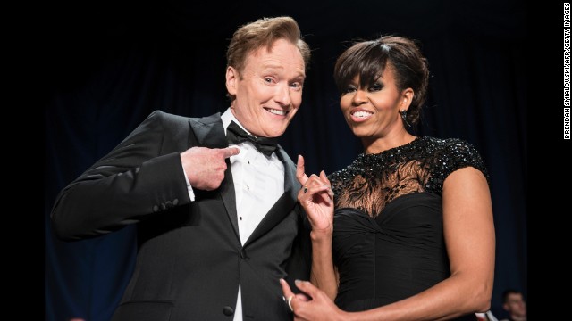 Comedian Conan O'Brien and first lady Michelle Obama joke around.