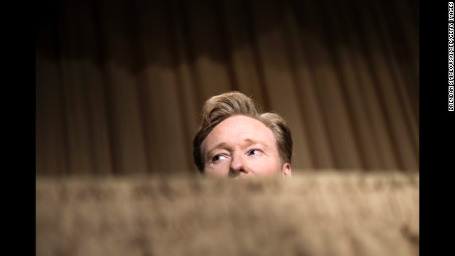 Conan O'Brien, and his hair, catch a glimpse of something during the proceedings.