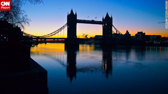 London's <a href='http://ireport.cnn.com/docs/DOC-891593'>Tower Bridge</a> is reflected in the Thames at dawn.