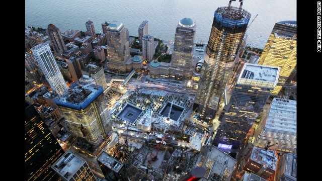 Construction continues on One World Trade Center on August 12, 2011, beside the memorial footprints of the twin towers.