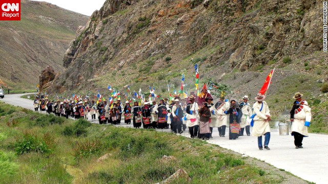 Farmers and monks process in a <a href='http://ireport.cnn.com/docs/DOC-806805'>blessing of the crops</a> in mountainous Tibet, north of Lhasa. "Incense is being burned in the large pot at the front. Prayers and the parade are the bulk of this ceremony and all traffic must halt for the holy procession to pass," says Lee Gunderson, who shot this photo.