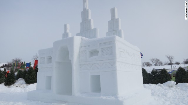 The crew of "Anthony Bourdain Parts Unknown" stops to admire an ice castle at the Quebec Winter Carnival.