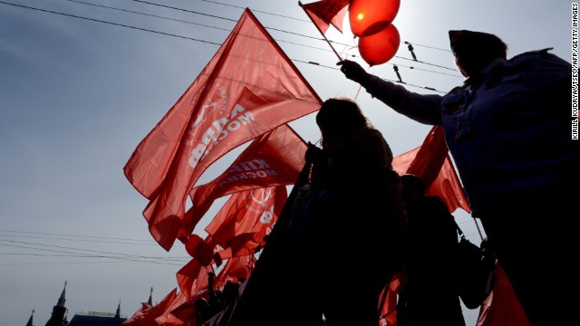 Russian communist party activists carry red flags and banners during their traditional May Day rally in Moscow.