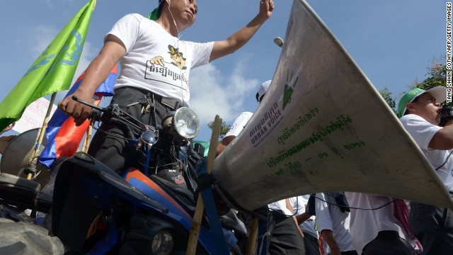 A Cambodian worker stands on a vehicle as he attends a May Day protest in Phnom Penh.