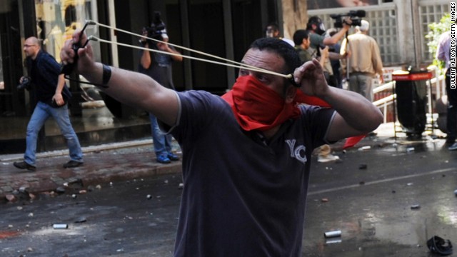 A May Day protestor uses catapults during clashes in Istanbul.