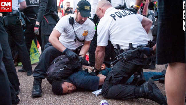 Photographer Michael Kandel was out at the May Day protest in Washington yesterday evening when protesters veered off the marching path and stormed a GAP store. Police intervened to secure the entrance and a skirmish broke out, according to CNN.