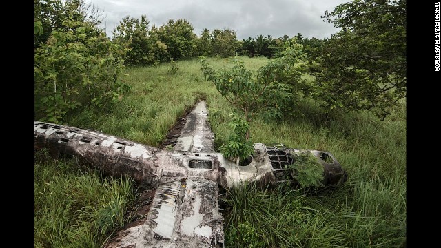 Dietmar Eckell's bid to photograph what he calls "miracles in aviation history" -- airplanes that were forced down without loss of life -- has taken him from African deserts to Papua New Guinean swamps, like this photo.
"In Papua New Guinea, hiking to the plane was like a time travel -- you pass villages where nothing has changed in the 70 years since the plane landed," says Eckell. "No electricity, running water, and they still go fishing in the dug-out canoes." The B-24D Liberator, an American heavy bomber, has rested in this swamp since 1943, during World War II.