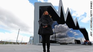 Architect Zaha Hadid, one of only two women who have won the Pritzer Prize, stands in front of the Riverside Museum she designed for Glasgow, Scotland. 